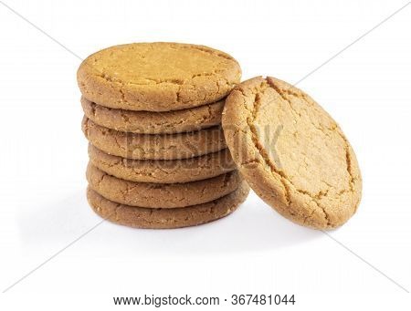 Close Up Plie Of Ginger Biscuits With One Stood    Isolated On A White Background