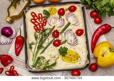 Raw Garden Focaccia. Fresh Dough And Vegetables, Olive Oil, Greens