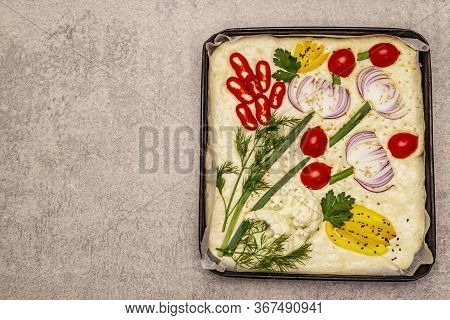 Raw Garden Focaccia. Fresh Dough And Vegetables, Olive Oil, Greens