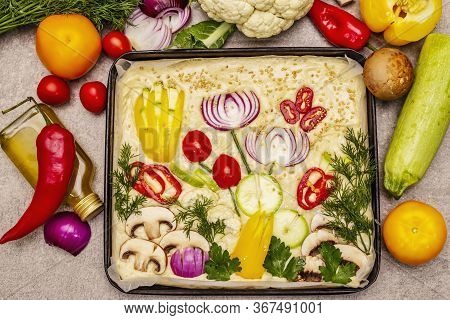 Raw Garden Focaccia. Fresh Dough And Vegetables, Olive Oil, Greens