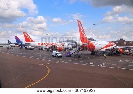 Luton, Uk - July 12, 2019: Easyjet Airbus A319 Fleet With Wizzair And Ryanair In Background At Londo