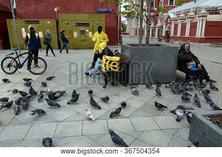 Moscow, Russia - May 9, 2020:couriers Of The Yandex Food Fast Food Delivery Service In The Center Of