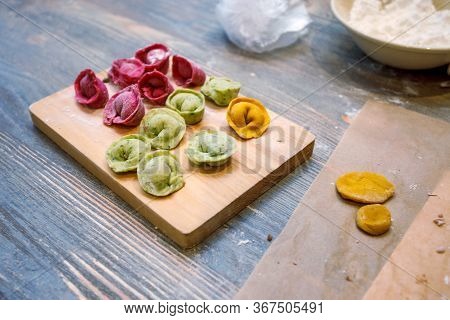 Cooking Class, Culinary. Food And People Concept, Molding Of Colorful Pelmeni Or Meat Dumplings, Nat