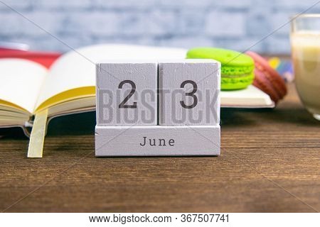 June 23 On The Wooden Calendar.the Twenty-third Day Of The Summer Month, A Calendar For The Workplac