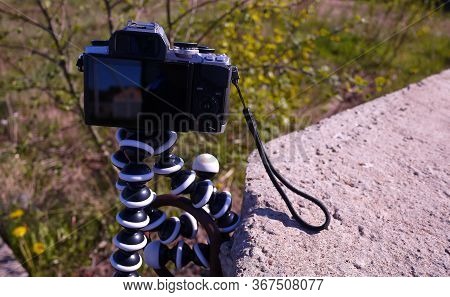 Flexible Tripod For The Camera. Details And Close-up