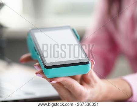 Female Hand With Manicure Holds Bank Mobile Device. Conclude An Acquiring Agreement Directly With Ba