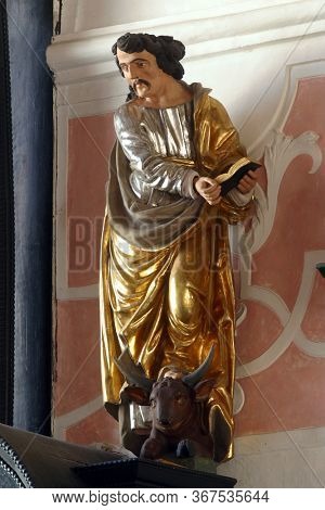 ZAGREB, CROATIA - MAY 16, 2013: Saint Luke the Evangelist, altar of the Holy Spirit in the Church of Saint Catherine of Alexandria in Zagreb, Croatia