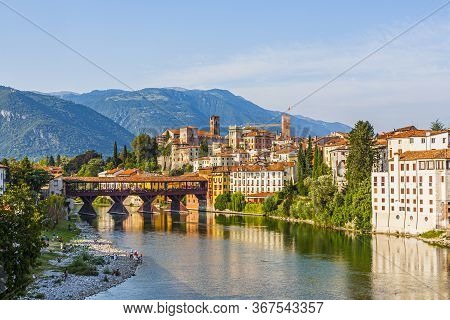 The Old Wooden Bridge Spans The River Brenta At The Romantic Village Basano Del Grappa, Italy