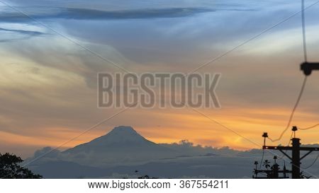 Panoramic View Of The Cayambe Volcano From The City Of Lago Agrio In The Ecuadorian Amazon On A Clou