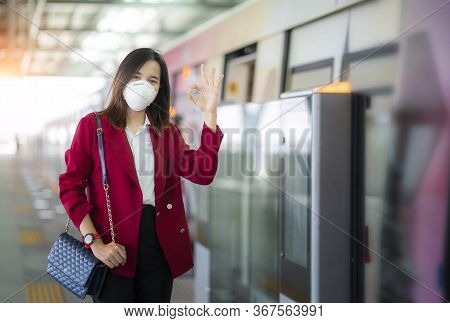 Asian Girl Use A Protection Mask For Prevent Pm 2.5 And Corona Viruus Or Covic 19 In Train Station I
