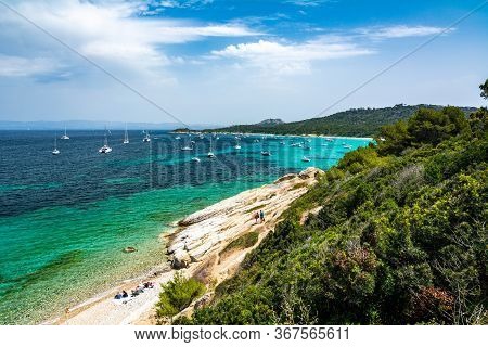 Porquerolles, France - June 10, 2019 : People On The Beach Of Courtade In Porquerolles, One Of The M