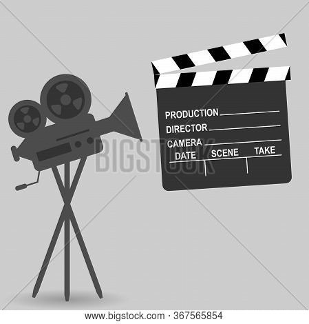 Vintage Professional Camera For Movies And Clapperboard