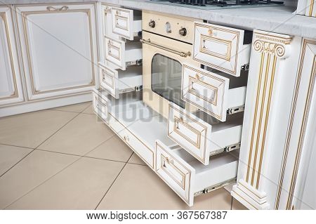 Modern Kitchen Interior In Classic Antique Style With Golden Elements In Beige Colors With Wood Faca