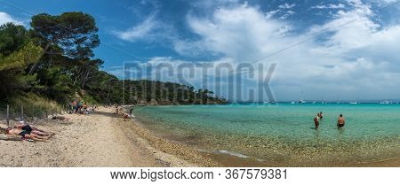 Porquerolles, France - June 10, 2019 : People On The Beach Of Notre Dame (our Lady) In Porquerolles,