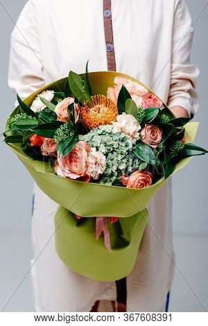 Bouquet Of Flowers In Lime Color Foamiran Package In The Hands Of A Woman Florist. Rose, Hydrangea, 