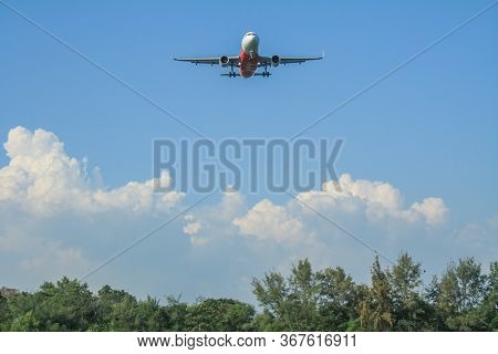 Rayong/thailand- ‎november ‎21, ‎2018: Blurred Photography Of Air Asia Airline Flying Over The Tree 