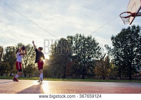 Woman Basketball Player Have Treining And Exercise At Basketball Court At City On Street