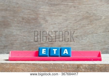 Tile Letter On Red Rack In Word Eta (abbreviation Of Estimated Time Of Arrival) On Wood Background