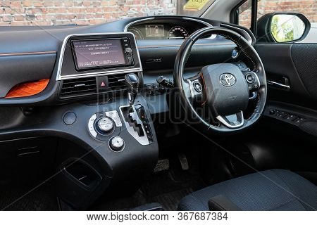 Novosibirsk/ Russia - May 03 2020:  Toyota Sienta, Dark Car Interior - Steering Wheel, Shift Lever A