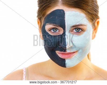 Girl With Black White Mud Mask On Face