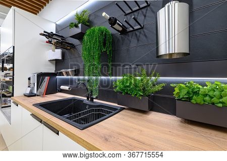 Showroom of domestic appliance store, row of stove top burners and other kitchen stuff