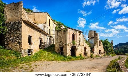 Ruined Buildings Of An Abandoned City. Architecture Of A Ghost Town.