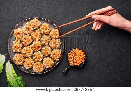 Shumai Or Kanom Jeeb Or Steamed Pork And Shrimp Dumplings On A Black Plate On Dark Slate Backdrop. S