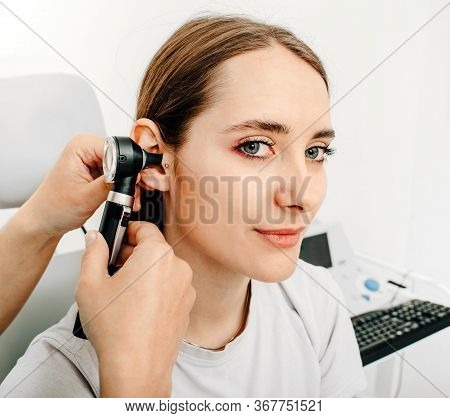 Hearing Exam For A Woman. Diagnosis Of Impairment And Hearing Testing In Adults. Patient Woman Durin