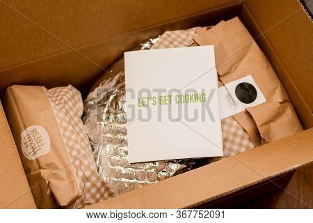 Sydney, Australia 2020-04-25 Hello Fresh Meal Kits In A Cardboard Box With Let's Get Cooking Brochur