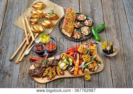 Grilled Vegan Seitan Steaks With Mixed Vegetables, Spicy Sauces And Crusty Baguette