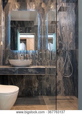 Front View Of Contemporary Gray Marble Bathroom With Vessel Bowl Sink, Mirror Back Light, Glass Show