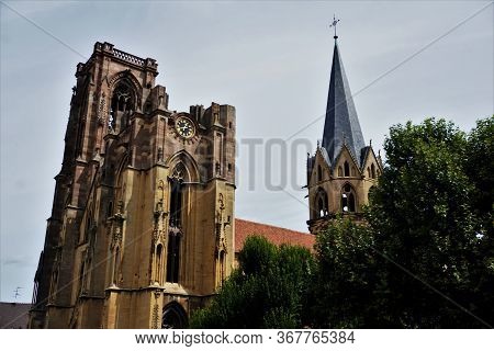 Belltower And Steeple Of The Assumption Church In The Village Rouffach, France