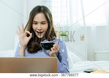 Facetime. Happy Young Asian Pretty Woman Drinking Coffee And Video Call Chat On Digital Laptop Compu