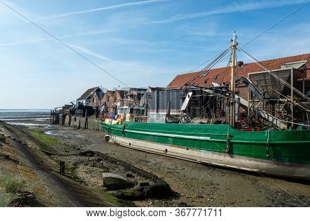 Coastline In Zeeuwse Village Yerseke With Famous Oysters Wells During Low Tide, Zeeland, Netherlands