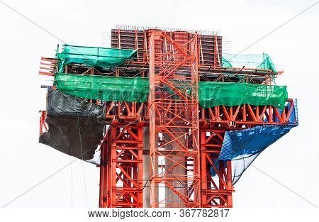 Red Steel Scaffolding With Slan At Construction Site Installed Beside Concrete Pillar And Beam Isola