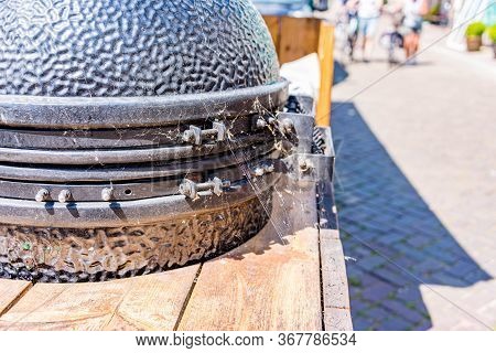 Deserted terrace with a big green egg in spiderwebs because of corona virus covid 19 during the pand