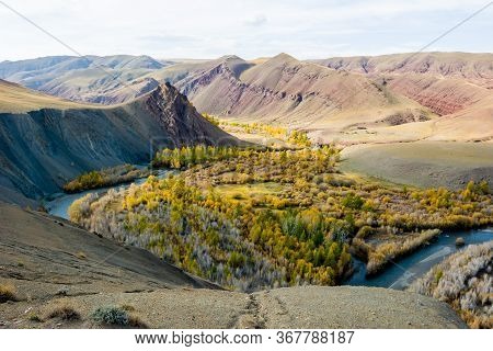 Beautiful Sun Valley And The Open River Kyzyltan Between The Mountains With Lush Clouds. Autumn Fore