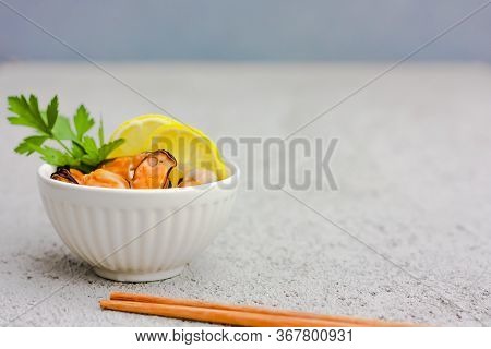Mussels Without Shell With Lemon Slices In White Ceramic Bowl. Seafood Concept. Selective Focus. Spa