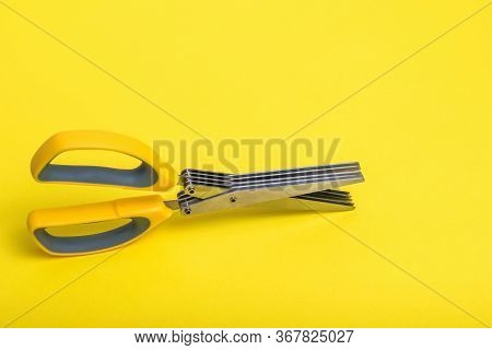 Salad Scissors With Multiple Blades On A Yellow Background. Devices For Slicing Salad.