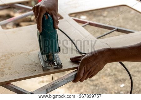 Reciprocating Saw. Power Tool Wood Cutting Construction Theme,cut According To The Outline.