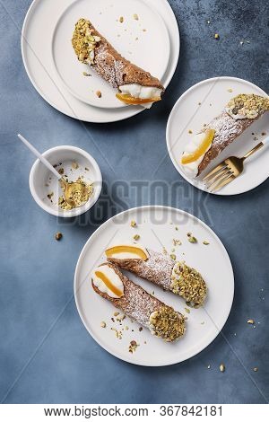 Traditional Italian Dessert Cannoli Siciliani On The Dark Background, Top View Image With A Copy Spa