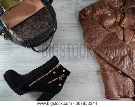Fashion And Blogger Flatly On A Light Wood Background. Top View Women Clothes, Footwear, Accessories