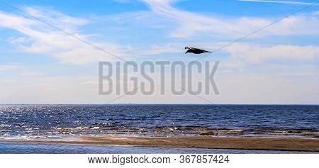 Seascape. Sandy Beach On The Sea On A Sunny Day With Beautiful Clouds.