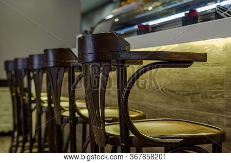 Wooden Stools For Customers In A Bar