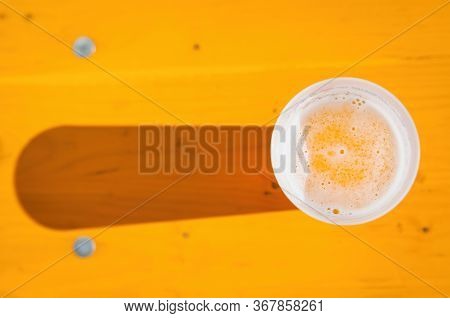 Cold Beer In The Summer Evening In Plastic Glass