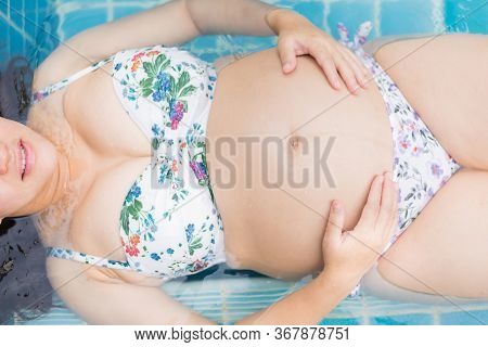 Asian Pregnant Woman. Mom And Newborn Baby. Mother Day And International Women Day. Relax And Recrea