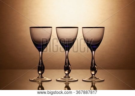 Empty Wine Glasses On A Clean Gradient Background. Empty Drinking Transparent Wine Glasses