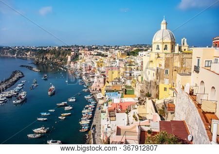 Aerial Drone View Of Vibrantly Colorful Houses Of Marina Corricella In Sunny Summer Weather At Proci