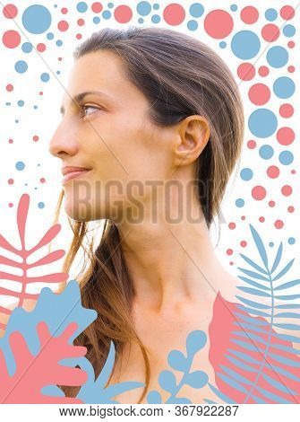 Close up profile portrait of an attractive, bare chested woman with long brown hair strong features