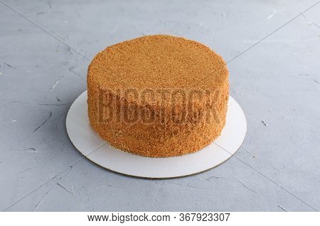 Cake Honey Cake Not Cut On A Gray Background Confectionery Delivery Of Sweets